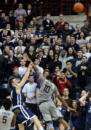Jack Montague, center-left, in a December 2014 game against UConn. (Image via Associated Press)